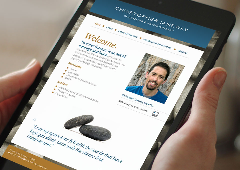 Hands holding mobile device displaying Christopher Janeway website
