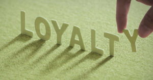 Closeup of small letters spelling loyalty