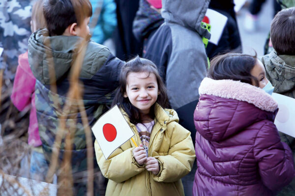 Young person holding Japan flag