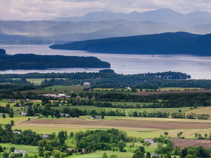 A long distance photo of Vermont and Lake Champlain