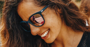 Person smiling wearing sunglasses