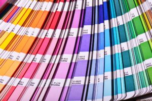Pantone book open to show rows of many colors