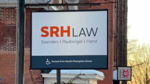 Outdoor sign that reads, "SRH Law - Saunders, Raubvogel, and Hand."