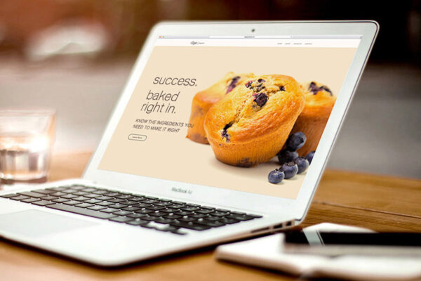 Laptop displaying 8 ingredients for a winning website