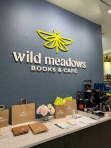 Wild Meadows logo on a wall