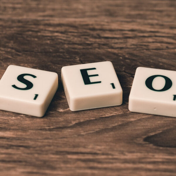 Tiled letters on table spelling out SEO