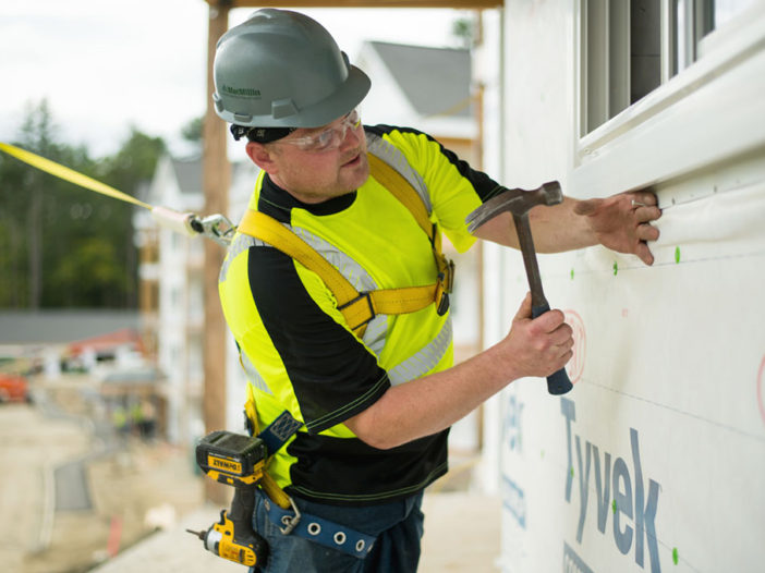 DEW Construction Employee working with hammer