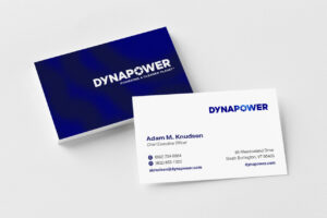 Stack of Dynapower business cards with top card flipped over to read contents