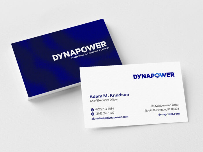 Stack of Dynapower business cards with top card flipped over to read contents