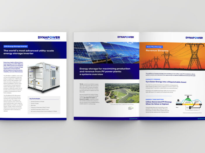 Three colorful Dynapower brochures spread across a table