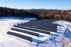 Solar panels in snowy field