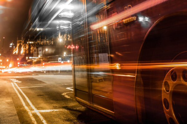 Long exposure photo of double decker bus at night