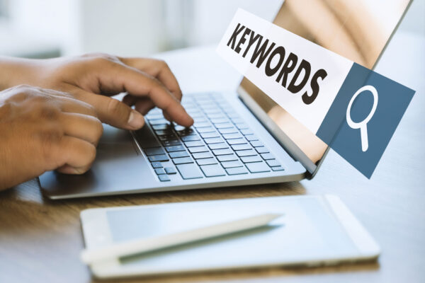 hands typing on laptop keyboard