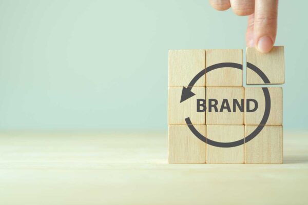 building blocks with text that reads "brand" with refresh symbol