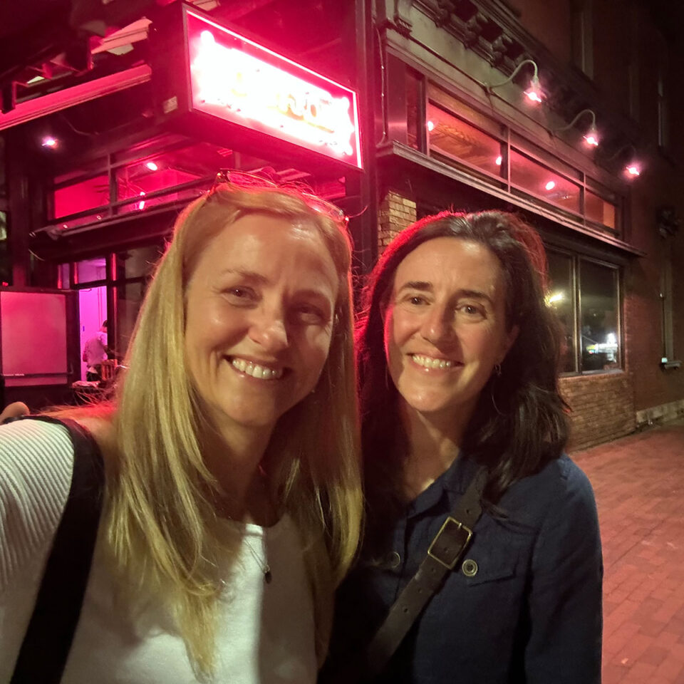 terri parent and catherine McIntyre celebrating outside of a restaurant in burlington, vermont