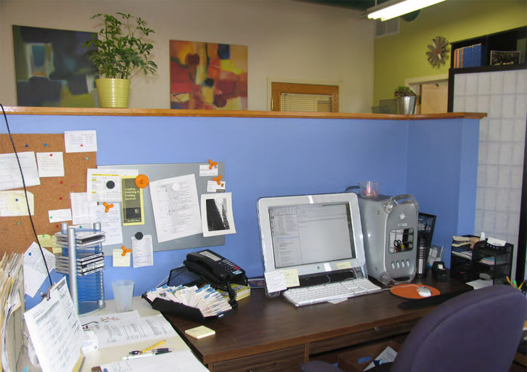 messy desk in stride creative group's old office, with old technology