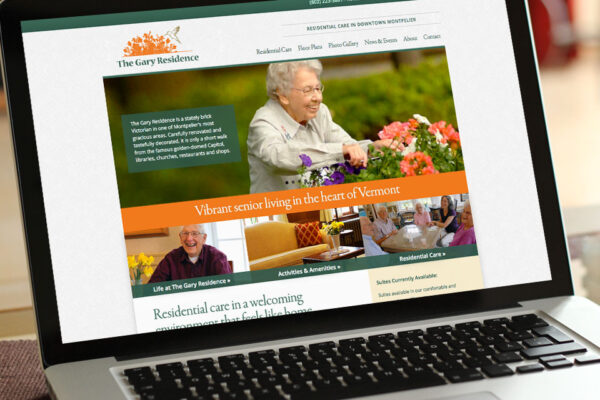 Laptop with website for seniors on screen