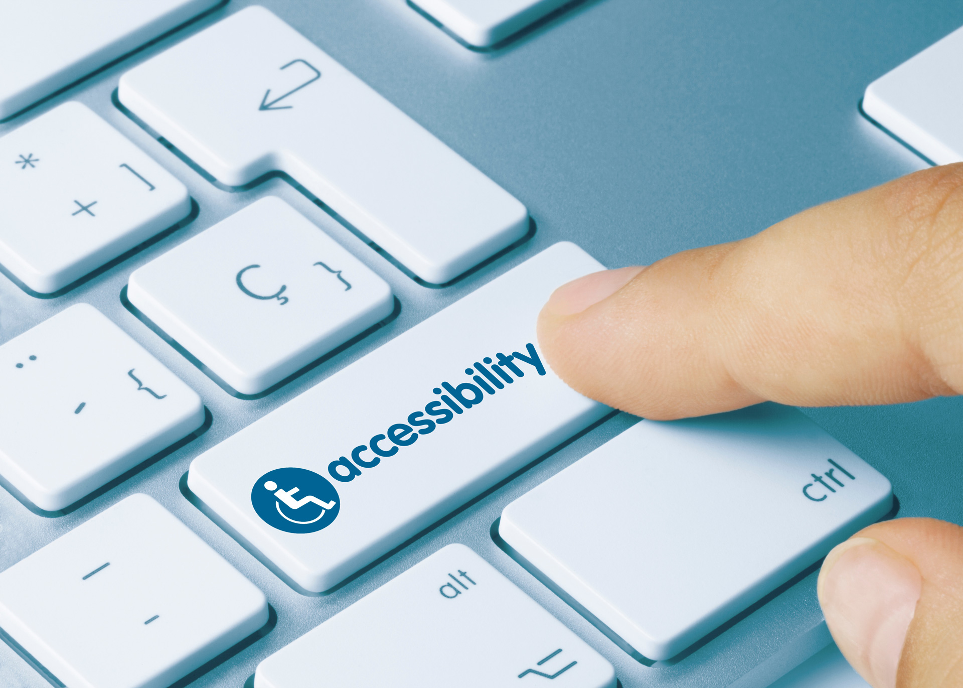 person's finger clicking button that reads "accessibility" with wheelchair symbol