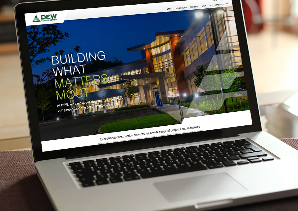DEW Construction website displayed on laptop